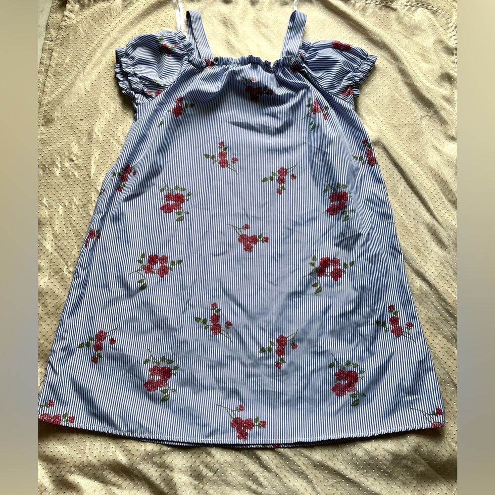 This is a long floral of the shoulder blouse in the size Large